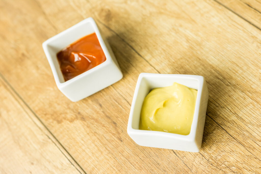 Mustard And Ketchup Sauce In White Bowl